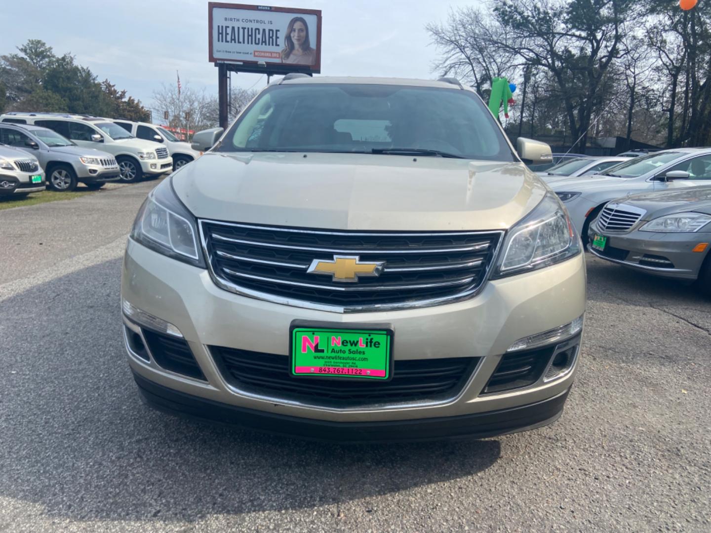 2015 GOLD CHEVROLET TRAVERSE LT (1GNKRGKDXFJ) with an 3.6L engine, Automatic transmission, located at 5103 Dorchester Rd., Charleston, SC, 29418-5607, (843) 767-1122, 36.245171, -115.228050 - Photo#1